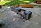 wooden massive park bench shape block with metal legs on granite