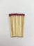 Wooden matches lying in a row on a white background. Macro shot.