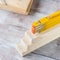 Wooden materials and measuring meter yellow pencil
