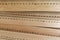 Wooden measuring rulers as a background. Measuring tools represent measurement, metrics, precision, accuracy and results