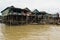 Wooden and metal houses built on stilts above the water of Tonle Sap lake, Kampong Phluk, Cambodia