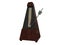 Wooden metronome on white surface