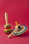 Wooden mexican toys against red background