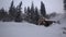 Wooden mill in winter and oven smoke