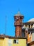 Wooden Minaret of a small mosque against the blue sky in Istanbul