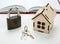 Wooden miniature house with keys and padlock Home security