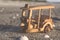 Wooden miniature tuk-tuk, most iconic Thailand transportation over beach background.retro and color tone effect