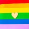 Wooden mockup heart on LGBTQ colors flag