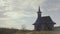 Wooden Moldavian rural Orthodox church in the woods on a rainy day, Chisinau, Moldova