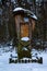 wooden monument covered with snow