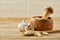 Wooden mortar and pestle with garlic and grind spicies on rustic table, close-up, selective focus