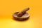 Wooden Mortar and pestle isolated on orange background