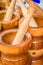 Wooden mortar and pestle for sale at the market. Mortar and pestle is a kitchen implement used to prepare ingredients or substance