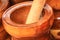 Wooden mortar and pestle for sale at the market. Mortar and pestle is a kitchen implement used to prepare ingredients or substance