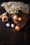 Wooden mortar and spices in a rustic arrangement on wood. top view