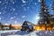 Wooden mountain hut on a cold winter night