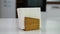 Wooden napkin holder with paper serviettes on kitchen table. Space for text