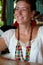 Wooden necklace worn by a cheerful young woman in Puerto Viejo, Costa Rica.