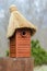 Wooden nest box handmade with thatched roof