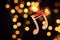 Wooden notes against blurred lights. Christmas music