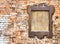 Wooden notice board against a brick wall background - image with copy space
