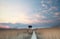 Wooden observation tower and path on mud