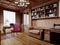 A wooden office cabinet in a classic style with sideboard cabinets with interior decor and a work desk with a soft pink chair