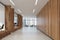 Wooden office corridor, brown sofas