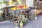 A wooden old cart with wheels and fruit oranges and pomegranates