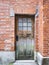 Wooden old door on Brick wall Architecture details