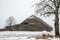 Wooden old shed barn in winter