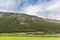 Wooden old traditional nordic houses with grass roofs in scenic landscape