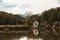 Wooden old windmills on lake in Astra Museum Sibiu Romania in autumn