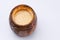 Wooden open barrel with fragrant honey on a white background. Close-up