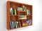 Wooden open shelves with books.