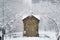 wooden orthodox chapel against the background of a winter landscape