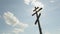 Wooden orthodox Cross in front of blue sky - Time Lapse
