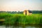 Wooden outdoor sauna by the lake in summer