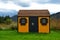 Wooden outdoor storage shed, backyard under mountain