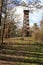 Wooden outlook tower on the top of the grassy hill