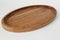 Wooden oval tray large on white background. Wooden utensils on white background. Dishes made of natural materials