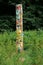 Wooden painted multicoloured totem pole