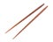 Wooden pairs of chopsticks on white background