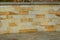 Wooden palisade from the poles of the retaining wall of the slope. terrace with a stone wall of sandstone beautiful textures. smoo