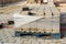 Wooden pallet with gray pavement stones at the site of the road works. Repair of the sidewalk on a city street