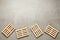 Wooden pallets on light grey table, flat lay. Space for text