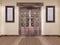 Wooden paneled double door with pictures on the wall