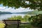 A wooden park bench in Mead Township, Pennsylvania, USA overlooking the Allegheny Reservoir in the Allegheny National Forest