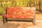 Wooden park bench with rain drops