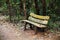 Wooden park bench, sitting area in the woods